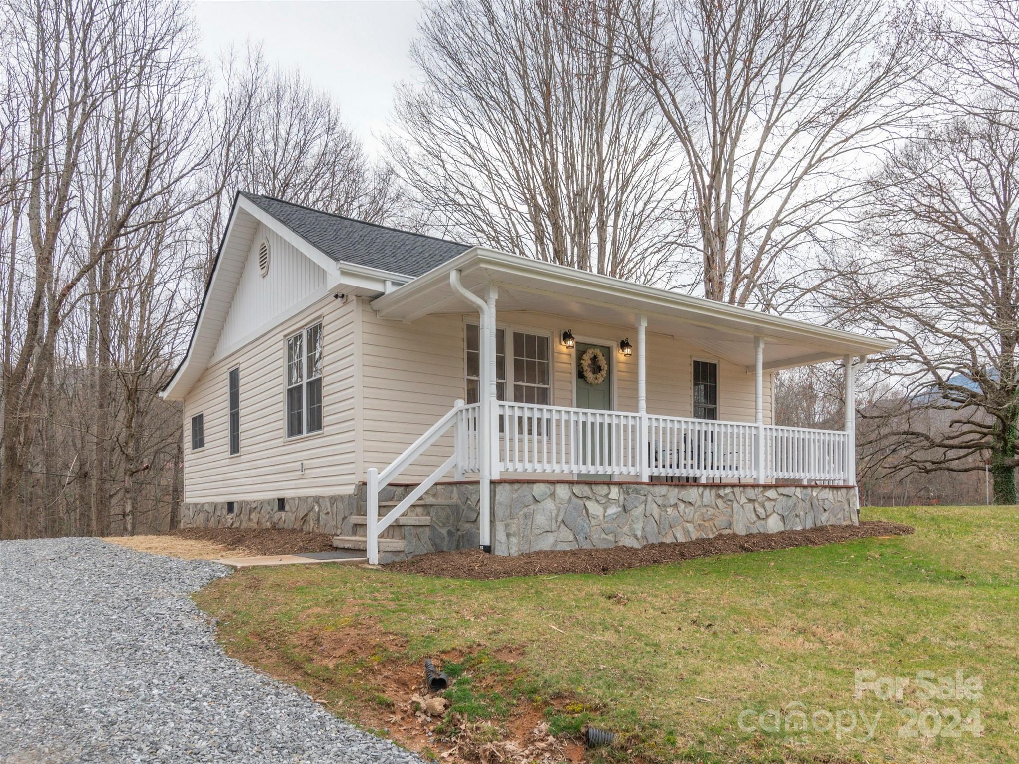 65 Squaw Ridge Road Waynesville, NC 28786 - Photo 23 of 24 a view of a house with a yard