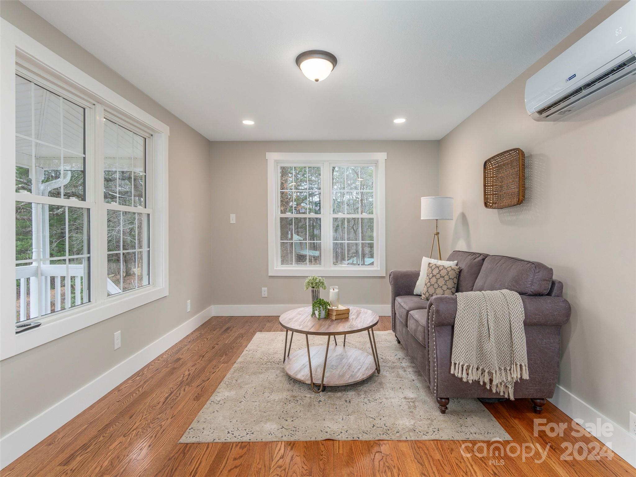65 Squaw Ridge Road Waynesville, NC 28786 - Photo 24 of 24 a living room with furniture and a window