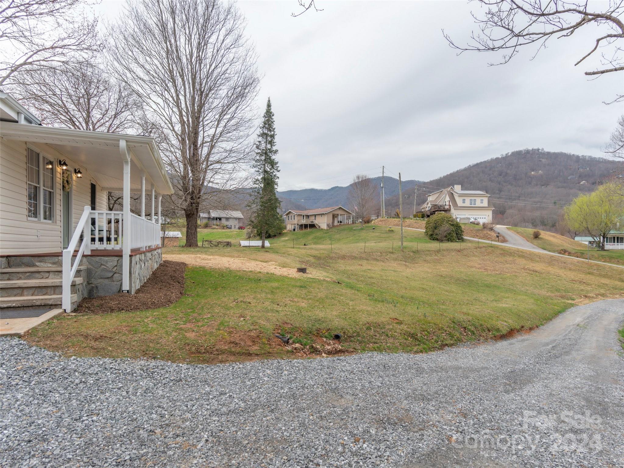 65 Squaw Ridge Road Waynesville, NC 28786 - Photo 6 of 24 a view of outdoor space with playground and green space