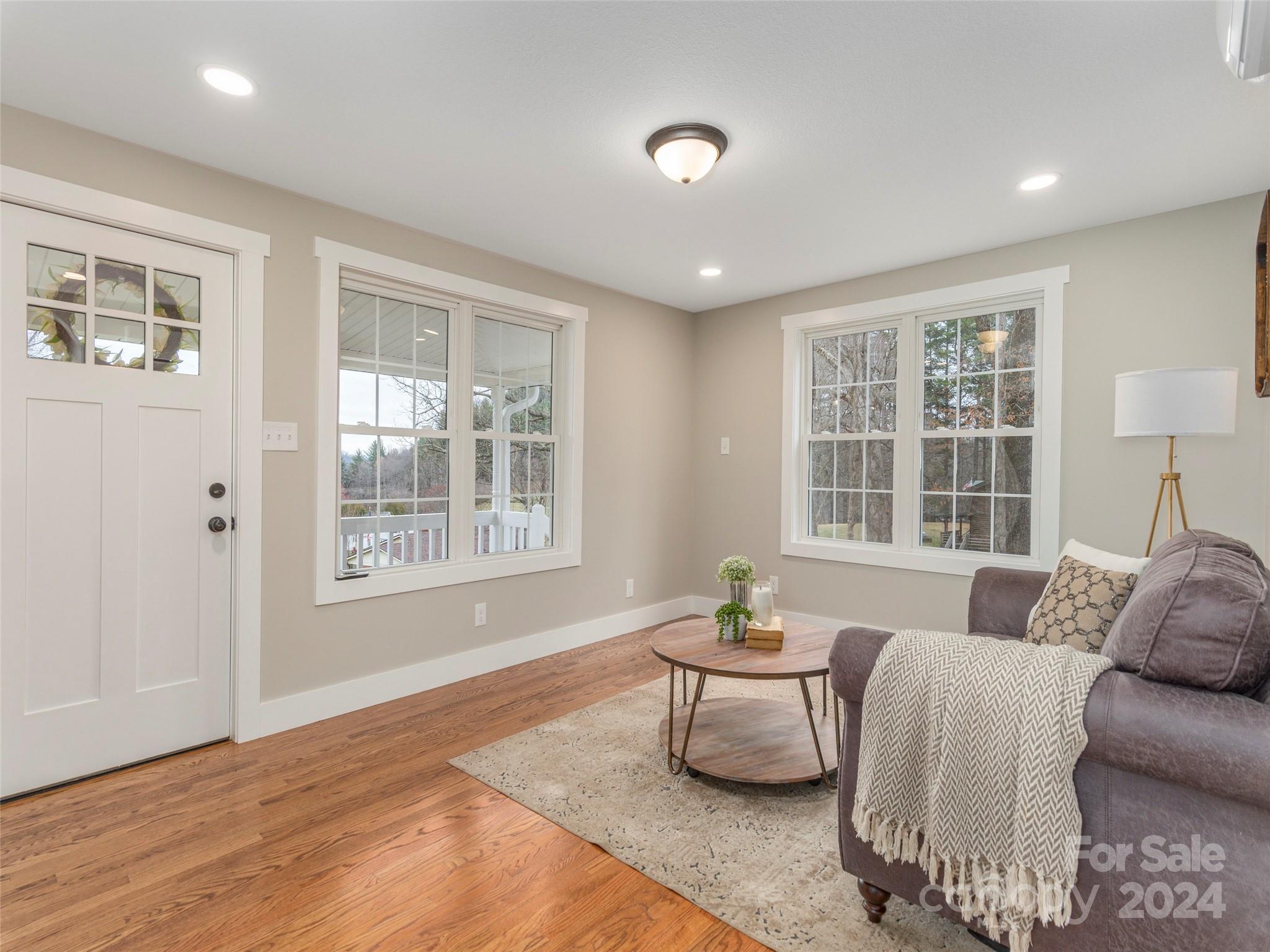 65 Squaw Ridge Road Waynesville, NC 28786 - Photo 10 of 24 a living room with furniture and a large window
