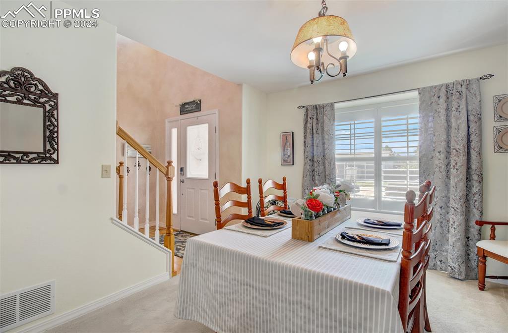 12110 Lazy E Road Peyton, CO 80831 - Photo 12 of 50 a view of a dining room with furniture window and outside view