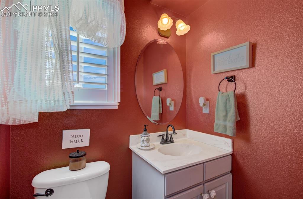 12110 Lazy E Road Peyton, CO 80831 - Photo 13 of 50 a bathroom with a sink and a mirror