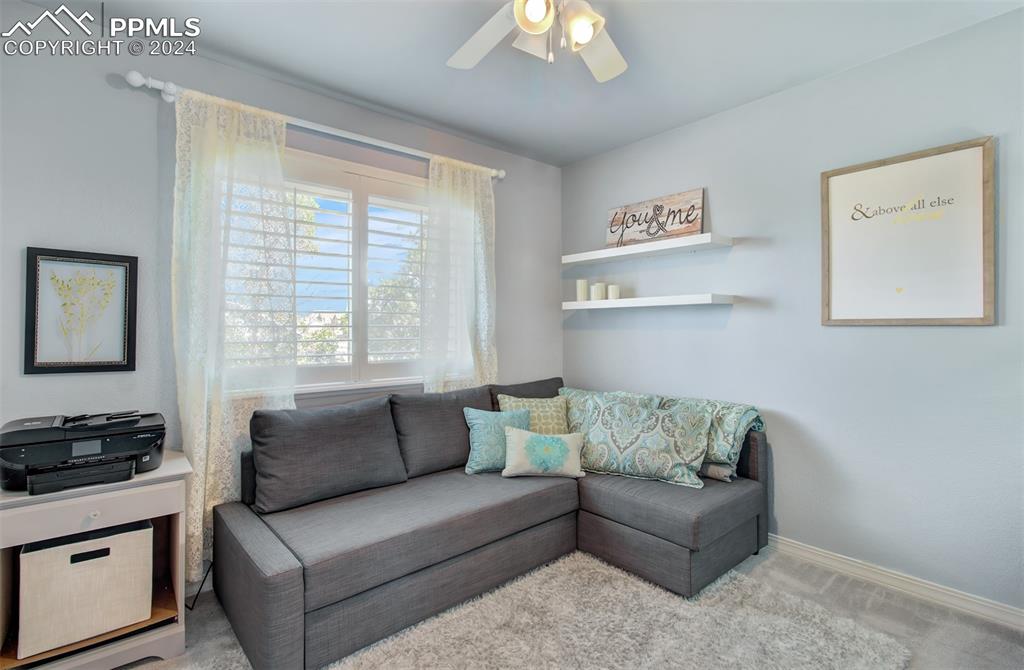 12110 Lazy E Road Peyton, CO 80831 - Photo 18 of 50 a living room with furniture and a window