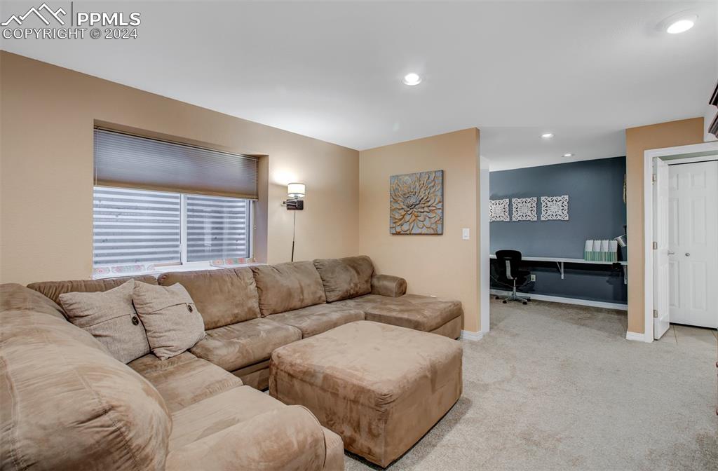 12110 Lazy E Road Peyton, CO 80831 - Photo 25 of 50 a living room with furniture and a large window