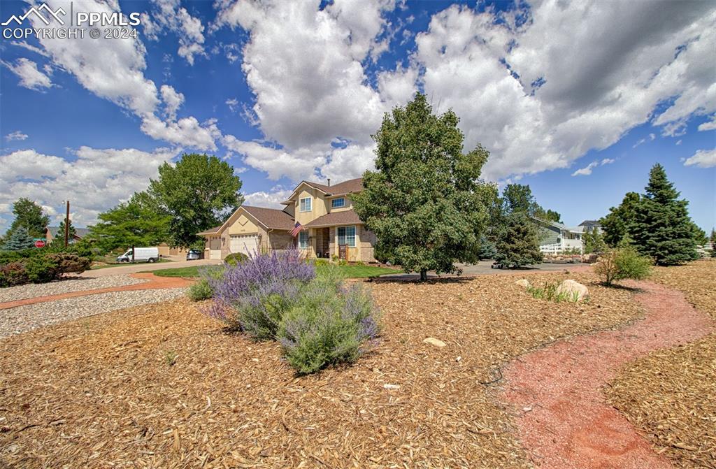12110 Lazy E Road Peyton, CO 80831 - Photo 33 of 50 a street view with residential house