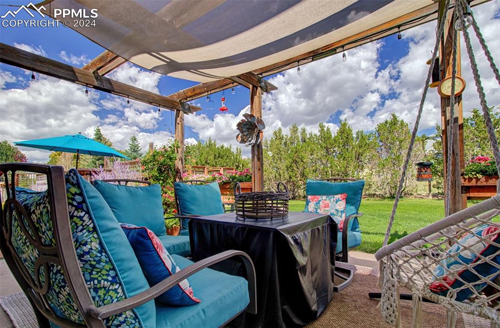 12110 Lazy E Road Peyton, CO 80831 - Photo 42 of 50 a view of an outdoor sitting area