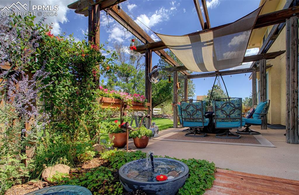 12110 Lazy E Road Peyton, CO 80831 - Photo 43 of 50 a garden view with a seating space