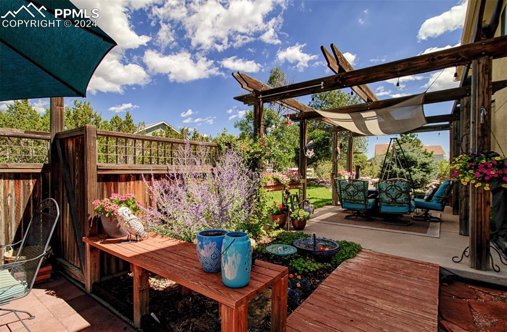 12110 Lazy E Road Peyton, CO 80831 - Photo 44 of 50 a view of a chairs and table in the patio