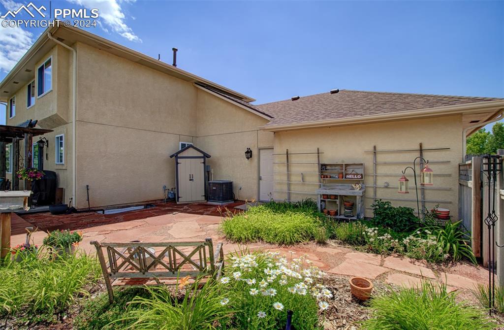 12110 Lazy E Road Peyton, CO 80831 - Photo 46 of 50 a view of a house with backyard and plants