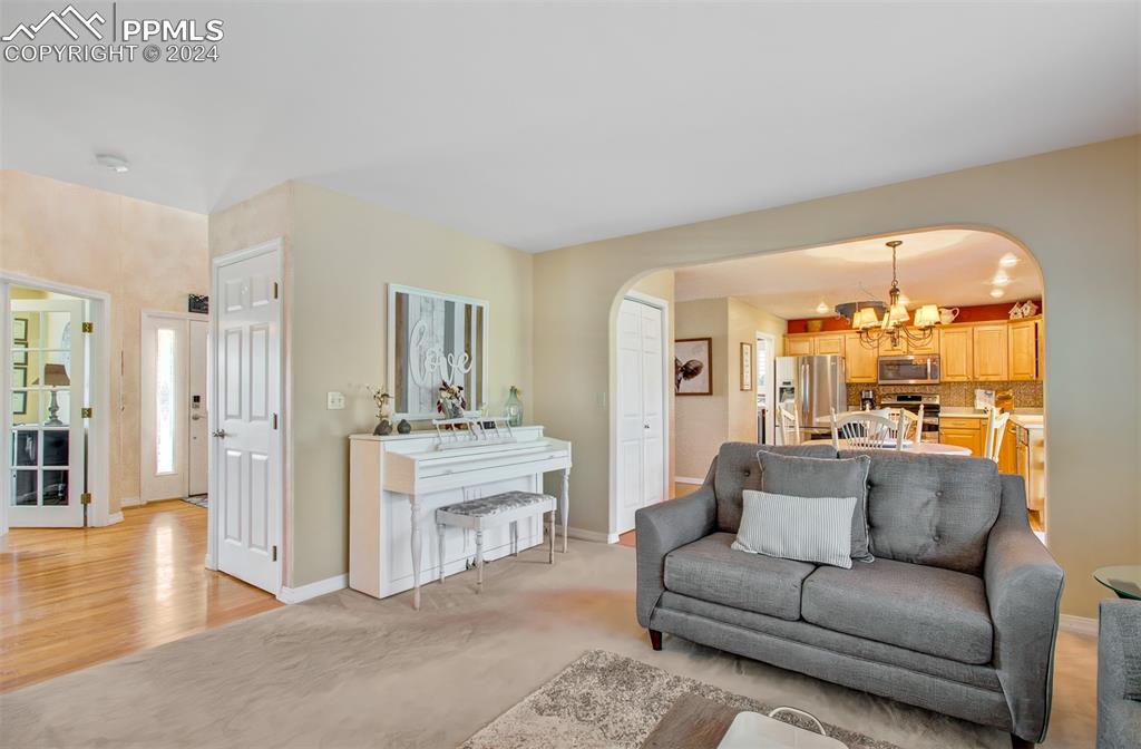12110 Lazy E Road Peyton, CO 80831 - Photo 6 of 50 a living room with furniture and a large window