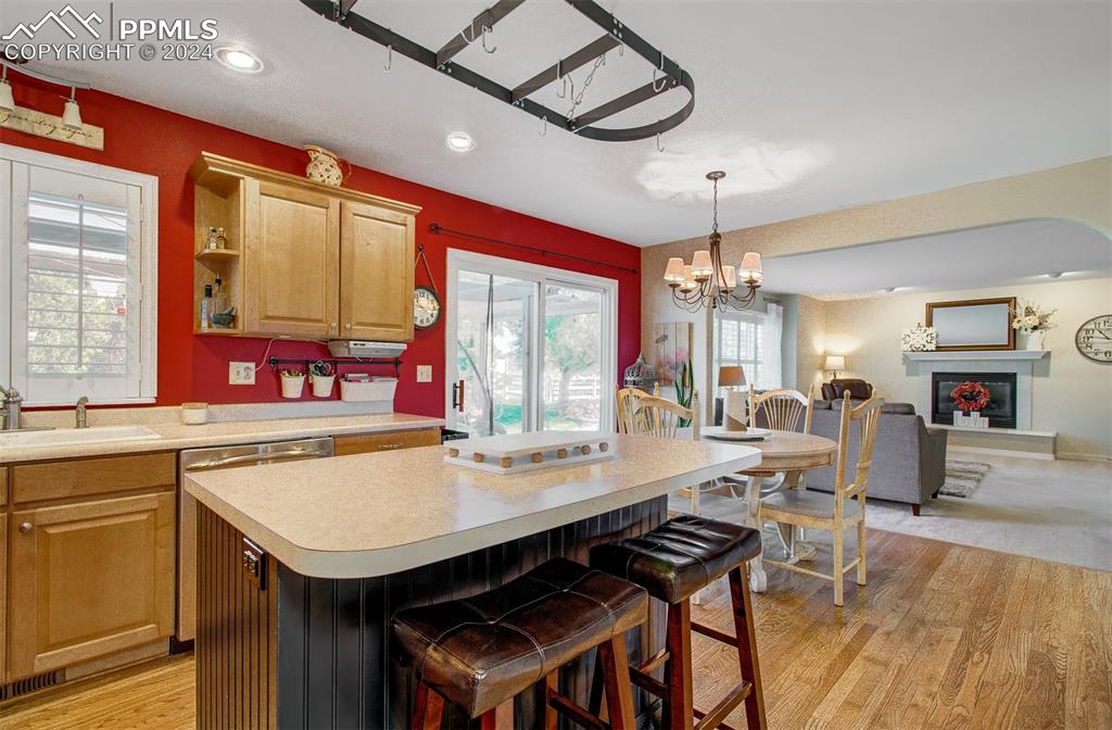 12110 Lazy E Road Peyton, CO 80831 - Photo 9 of 50 a view of a dining room with furniture window and wooden floor