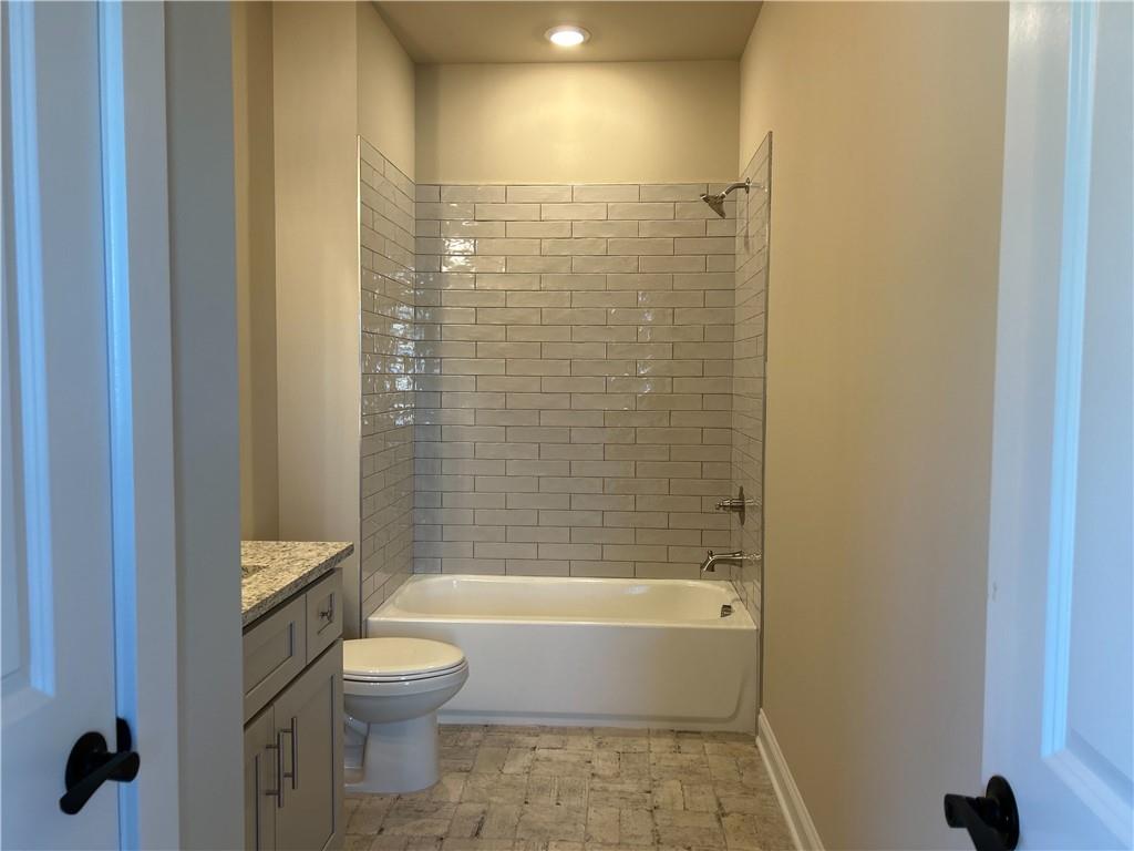 88 Morrison Street Watkinsville, GA 30677 - Photo 14 of 16 a bathroom with a bathtub and shower
