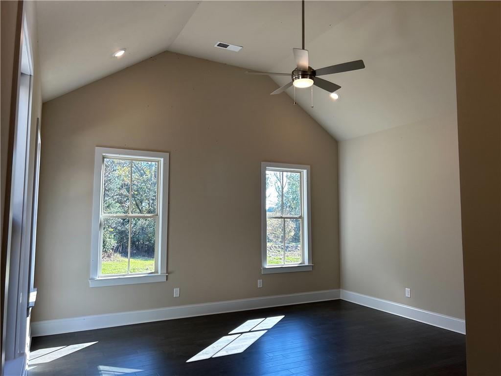 88 Morrison Street Watkinsville, GA 30677 - Photo 7 of 16 a view of an empty room with wooden floor and a window