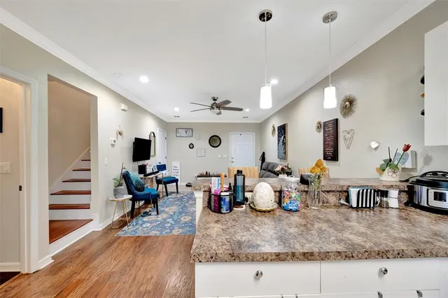 a bedroom with bed and a chandelier