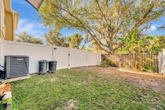 a backyard of a house with lots of green space
