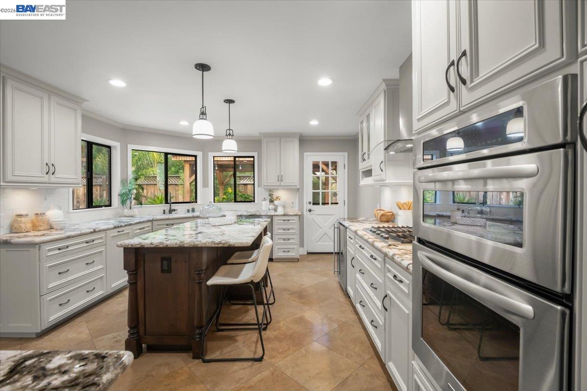 1784 Creek Road Livermore, CA 94550 - Photo 11 of 40 a kitchen with stainless steel appliances granite countertop a stove and a sink