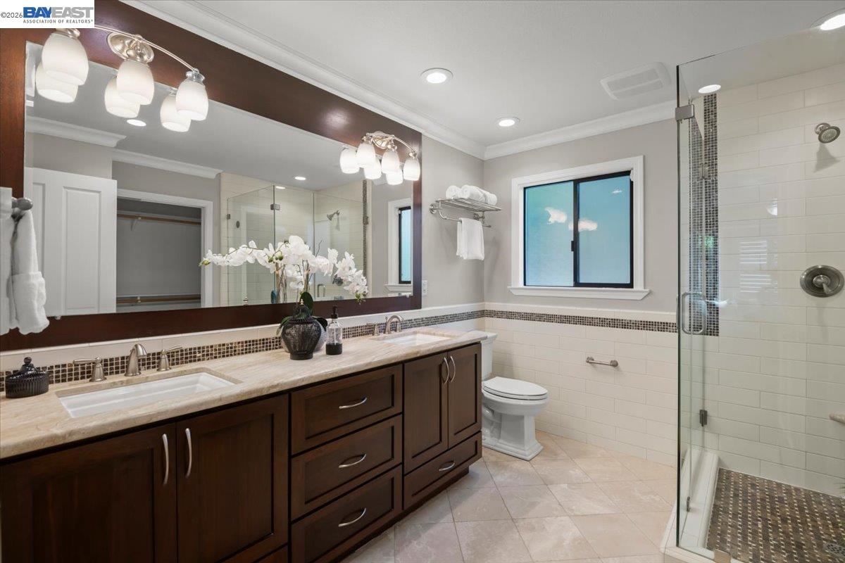 1784 Creek Road Livermore, CA 94550 - Photo 20 of 40 a bathroom with a double vanity sink and a mirror