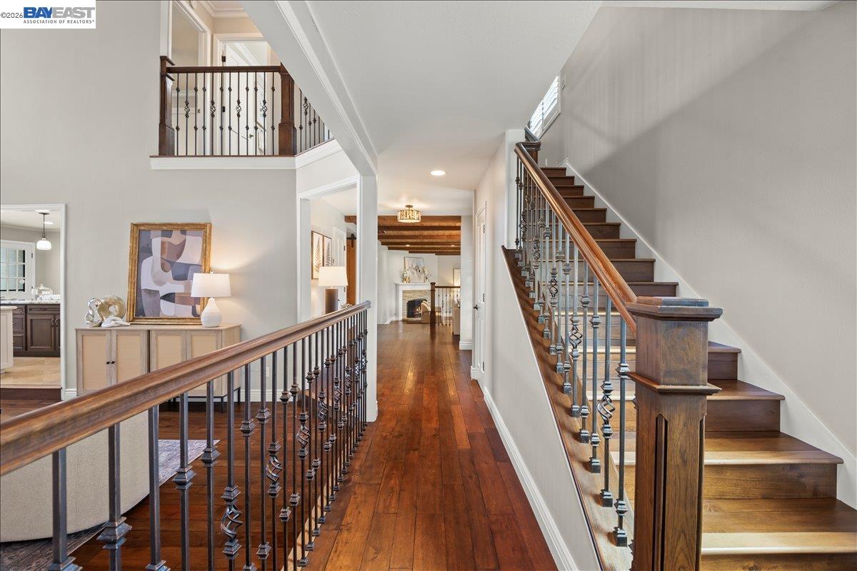1784 Creek Road Livermore, CA 94550 - Photo 22 of 40 a view of staircase with lots of frames on wall and wooden floor