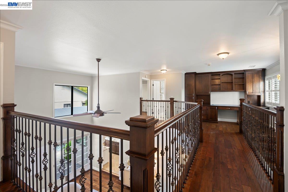 1784 Creek Road Livermore, CA 94550 - Photo 24 of 40 a view of a hallway with wooden floor and stairs