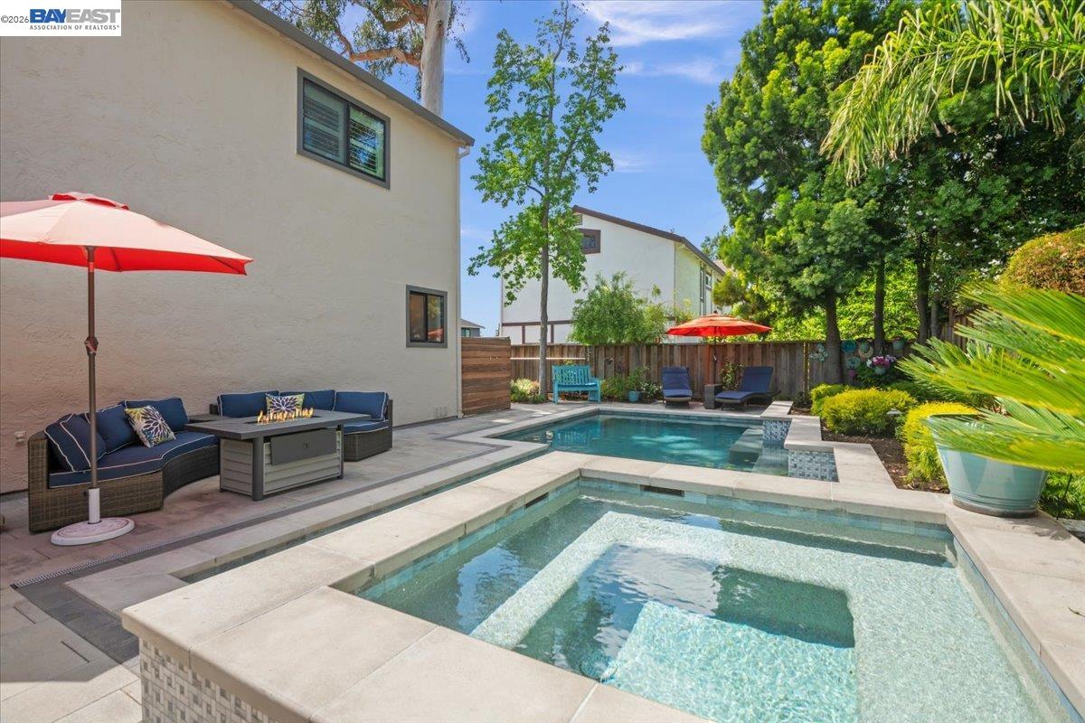 1784 Creek Road Livermore, CA 94550 - Photo 35 of 40 a swimming pool with outdoor seating and yard