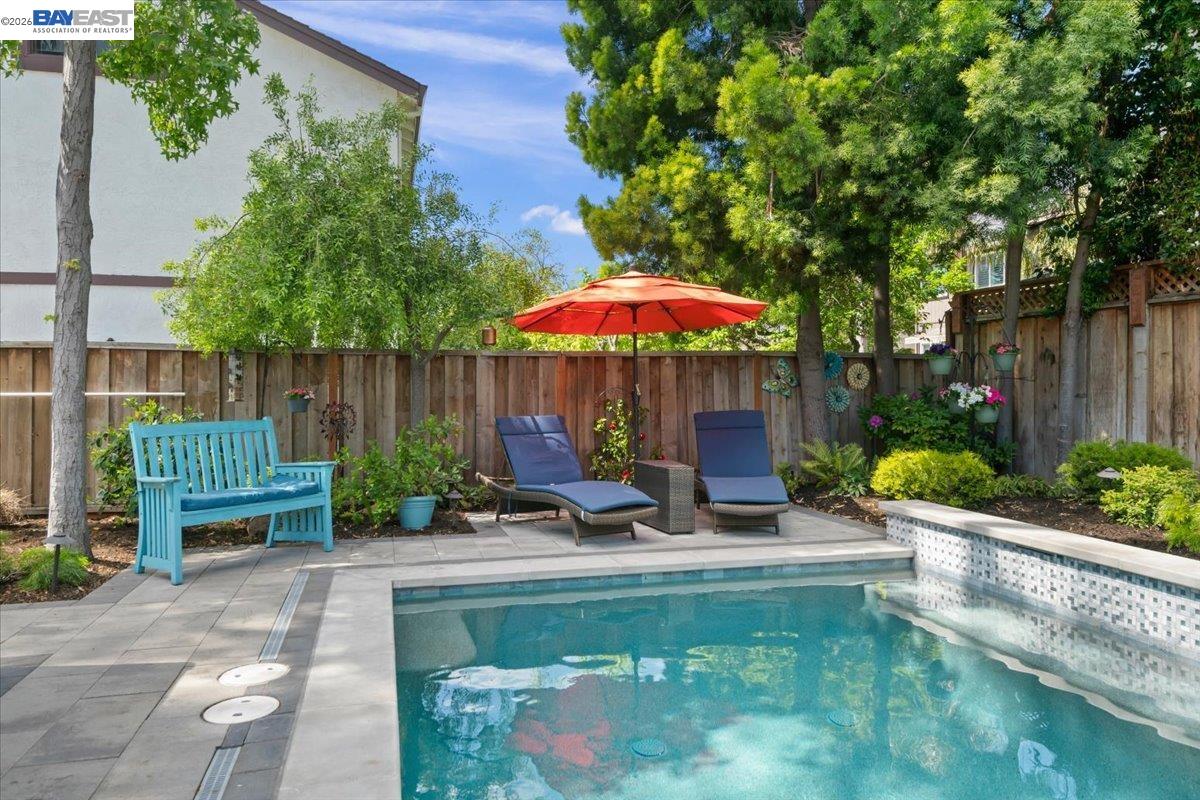 1784 Creek Road Livermore, CA 94550 - Photo 37 of 40 a view of a house with backyard sitting area and garden