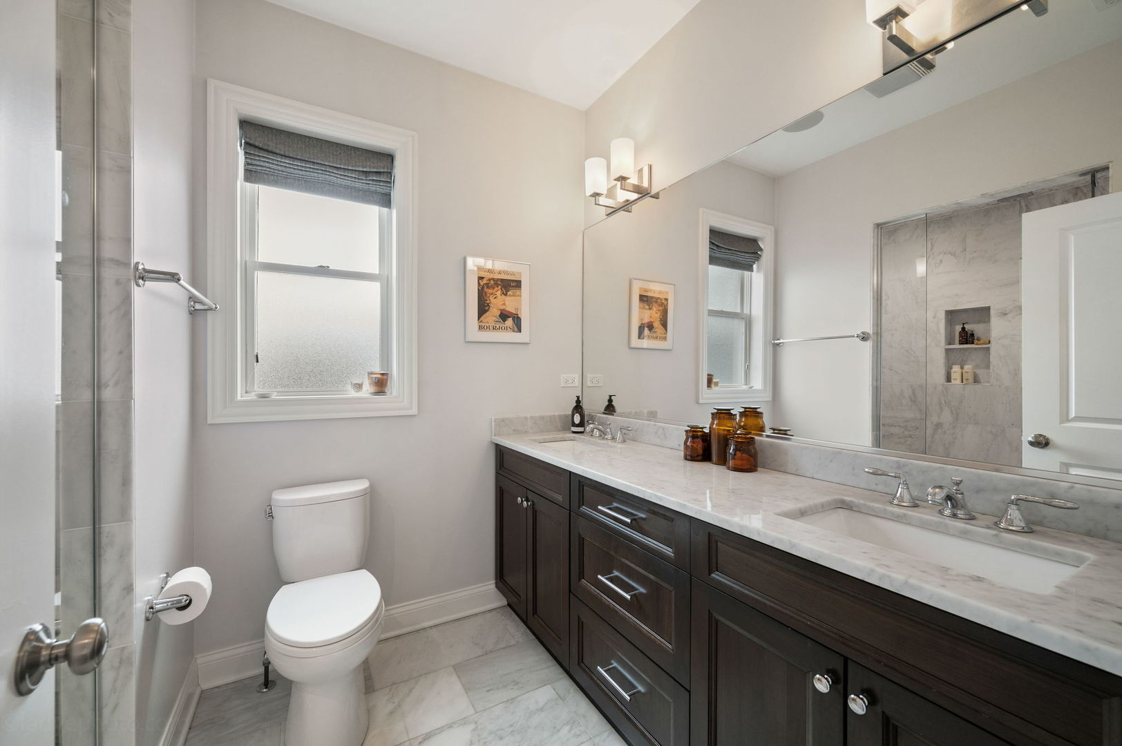 2700 North Wayne Avenue, Unit 3N Chicago, IL 60614 - Photo 12 of 22 a bathroom with a double vanity sink toilet and a mirror