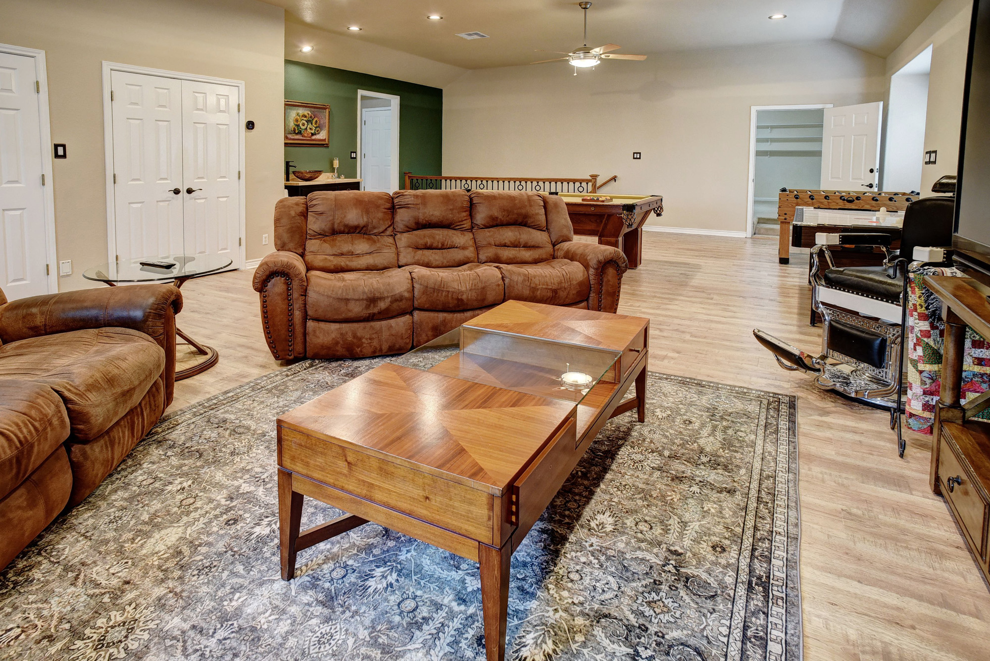 147 Spring Meadow Road Bastrop, TX 78602 - Photo 22 of 40 Spacious multi-purpose room featuring wood-finish flooring, recessed lighting, and a ceiling fan