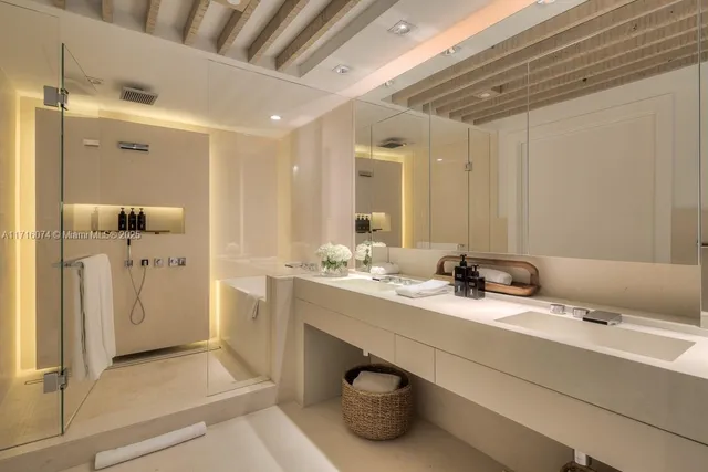 a bathroom with a double vanity sink and mirror