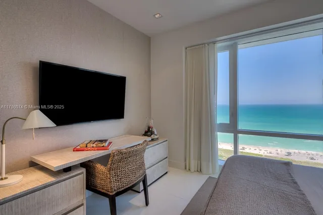 a room with furniture and a flat screen tv