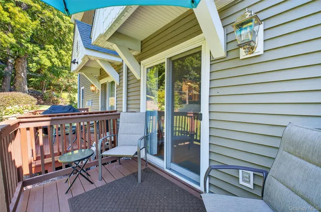 a view of a patio with a table and chairs