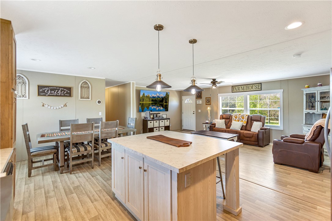 633 Project Road Iva, SC 29655 - Photo 11 of 38 This inviting space combines comfortable living with casual dining and a functional kitchen island.