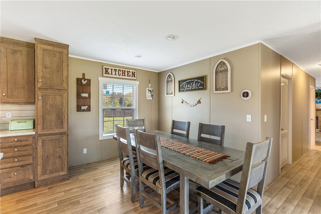 633 Project Road Iva, SC 29655 - Photo 12 of 38 This inviting dining area features ample space for gathering and boasts durable laminate flooring.