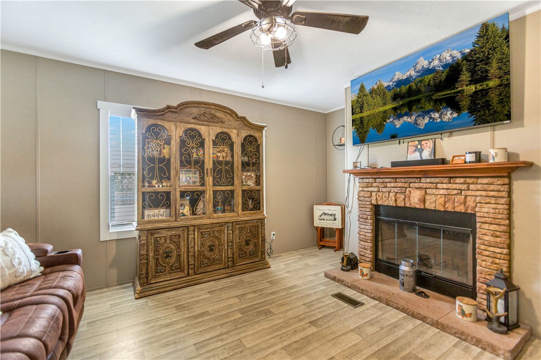633 Project Road Iva, SC 29655 - Photo 14 of 38 This inviting living area features a charming fireplace, perfect for cozy gatherings.