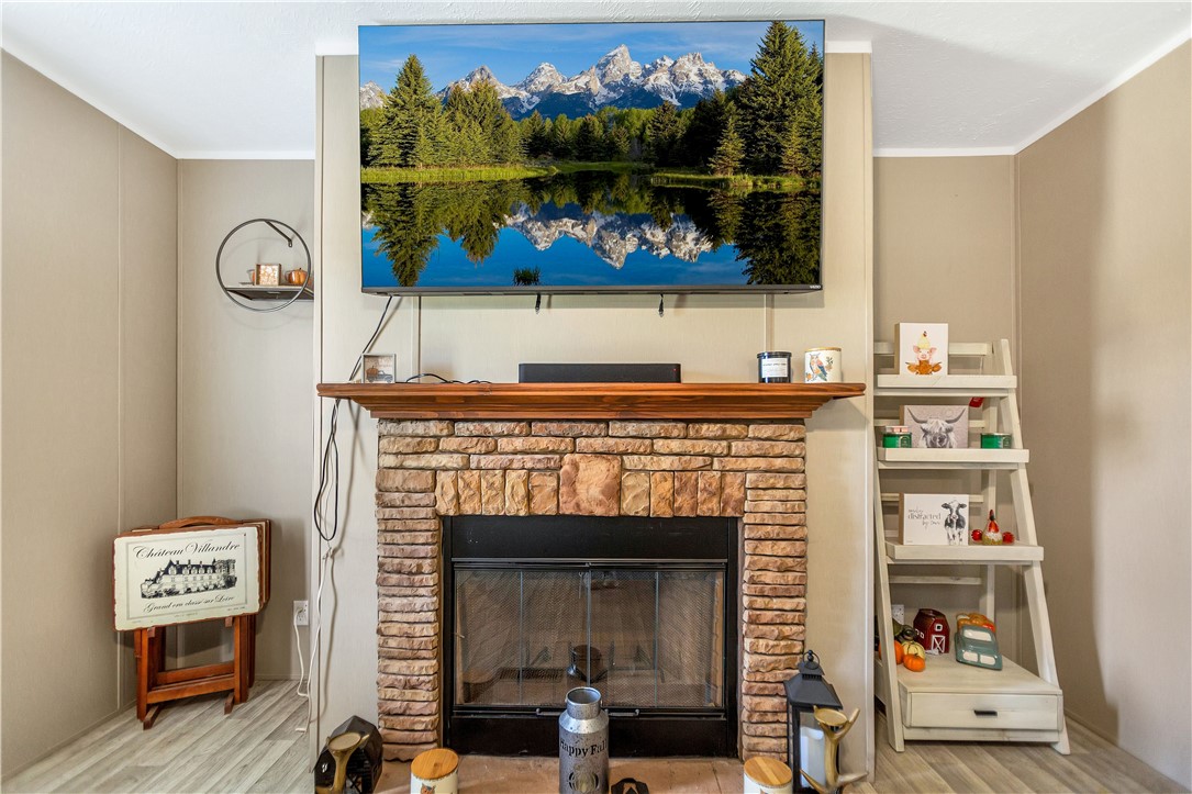 633 Project Road Iva, SC 29655 - Photo 15 of 38 This living area features a charming fireplace, perfect for cozy evenings at home.