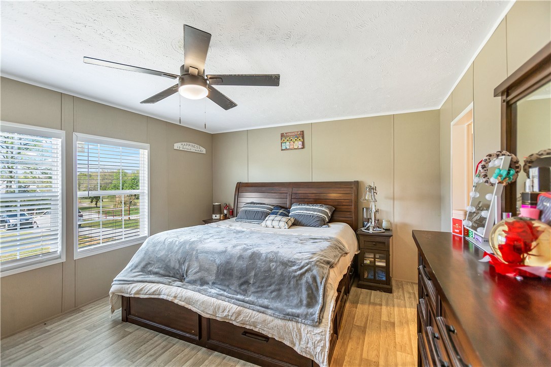 633 Project Road Iva, SC 29655 - Photo 16 of 38 This spacious bedroom offers ample natural light and a serene ambiance.