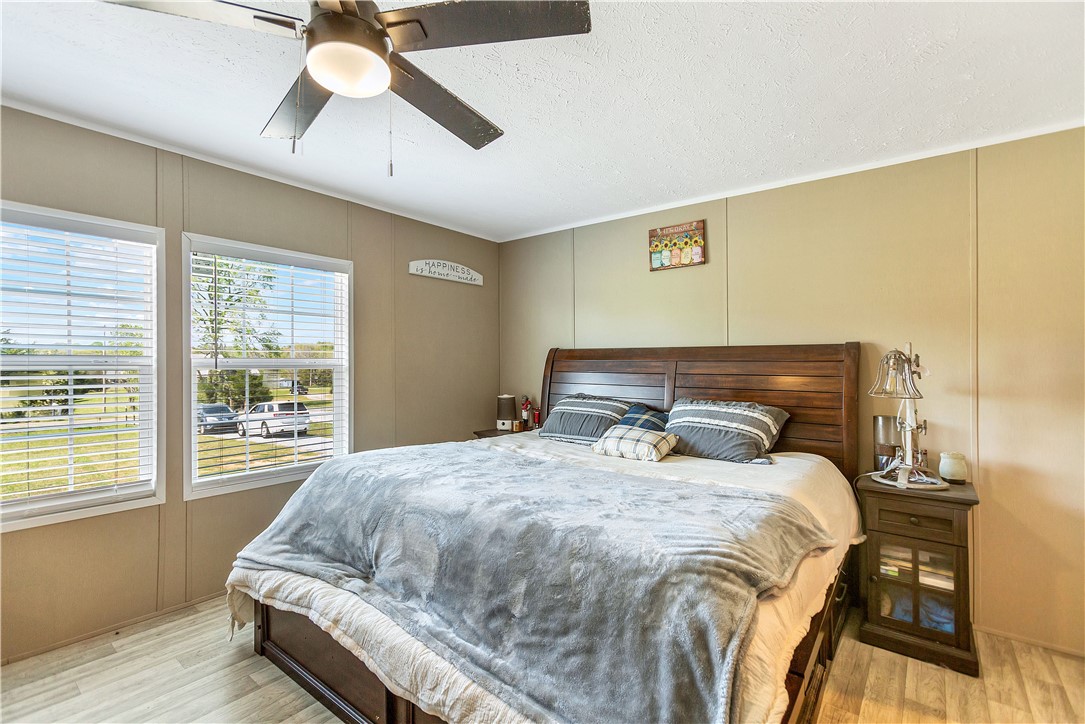633 Project Road Iva, SC 29655 - Photo 17 of 38 This cozy bedroom features bright windows, durable flooring, and a comforting ambiance.