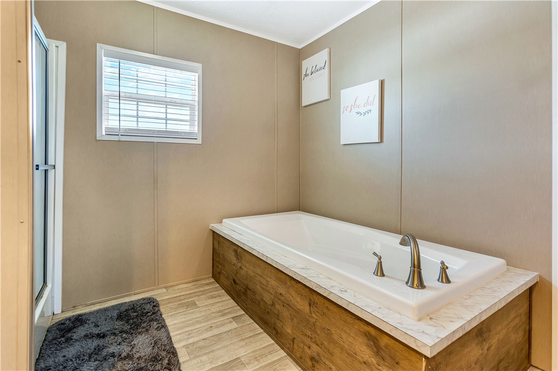 633 Project Road Iva, SC 29655 - Photo 22 of 38 Relax in this inviting bathroom with a built-in soaking tub, perfect for unwinding.