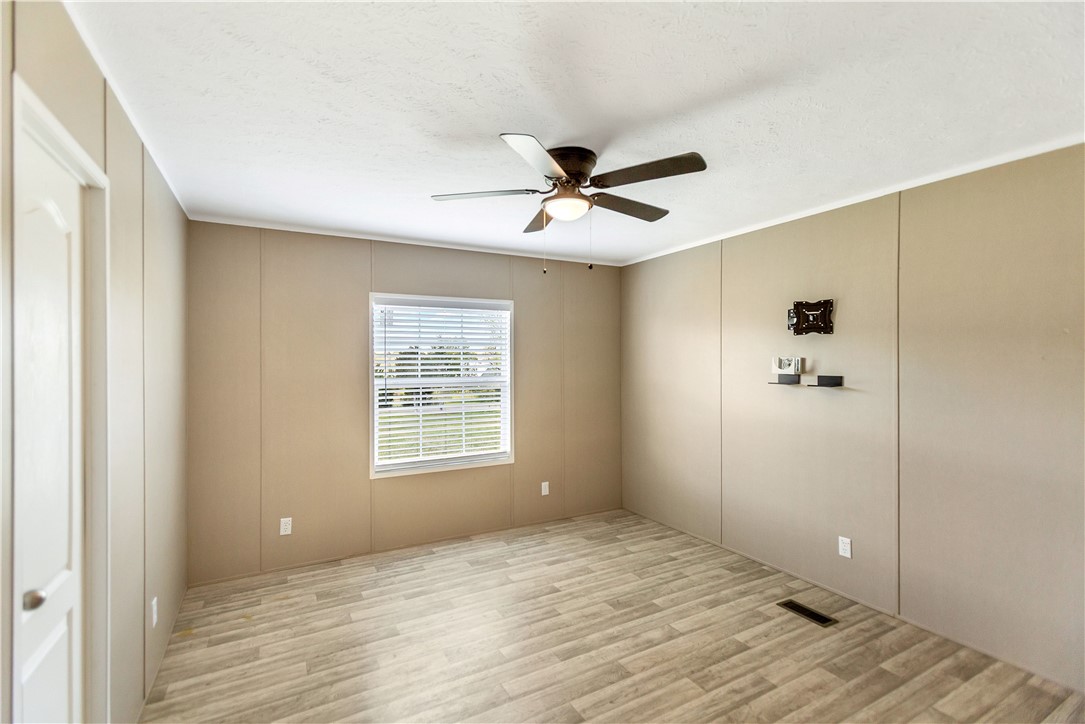 633 Project Road Iva, SC 29655 - Photo 23 of 38 Bright and airy room with durable flooring and ample natural light, ideal for relaxation or productivity.