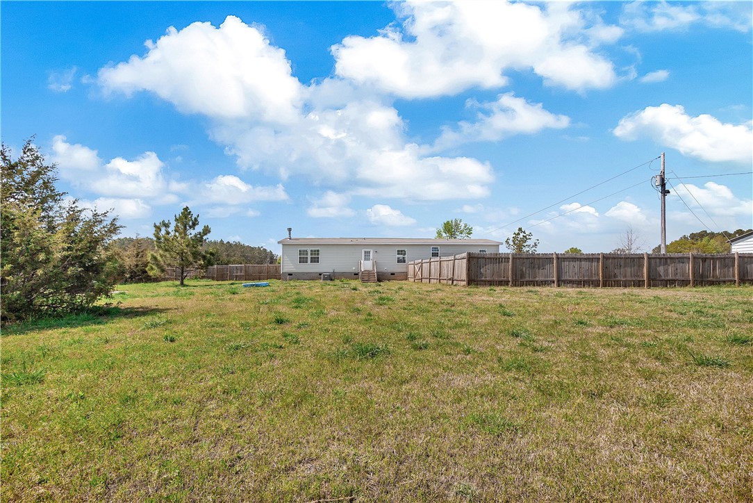 633 Project Road Iva, SC 29655 - Photo 31 of 38 Expansive green yard with a private fence, offering serene outdoor living.