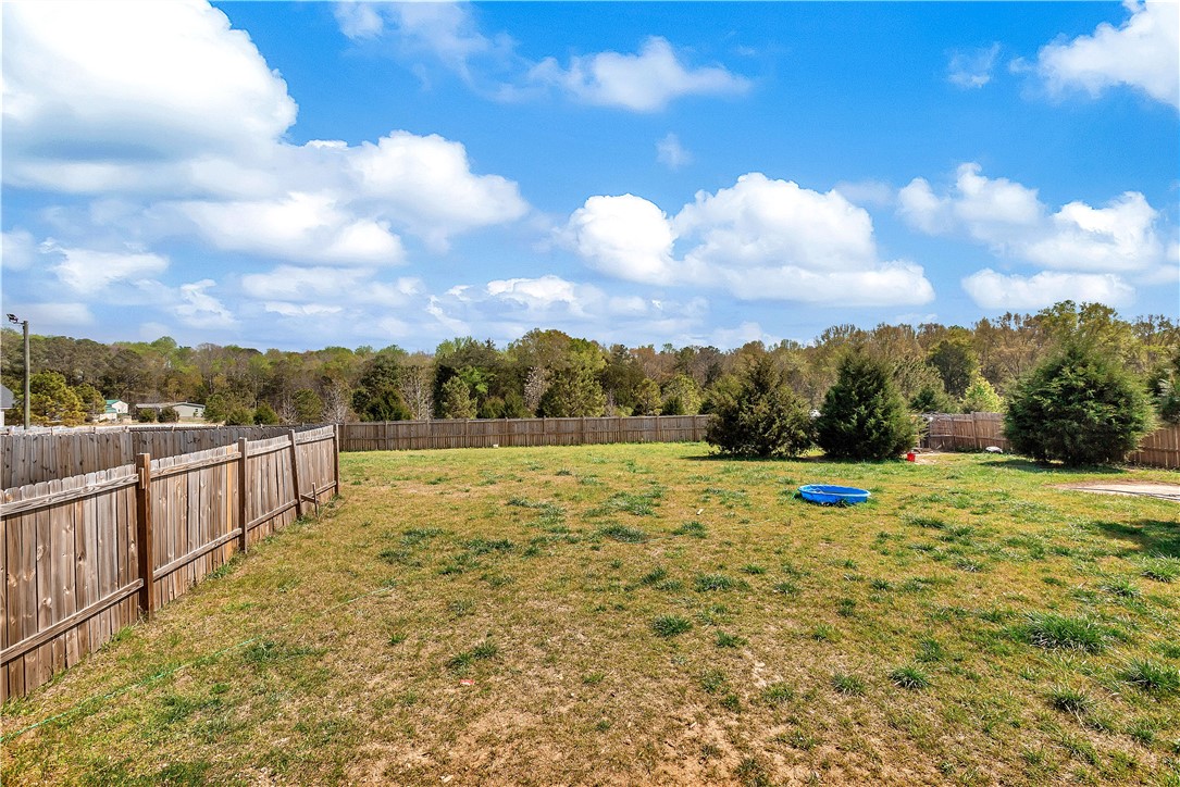 633 Project Road Iva, SC 29655 - Photo 36 of 38 This spacious backyard features natural privacy and endless possibilities for outdoor enjoyment.