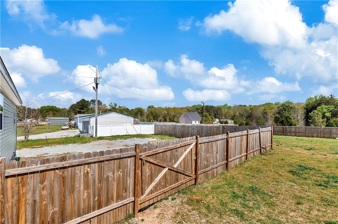 633 Project Road Iva, SC 29655 - Photo 37 of 38 This spacious backyard with a wooden fence offers ample room for outdoor activities.
