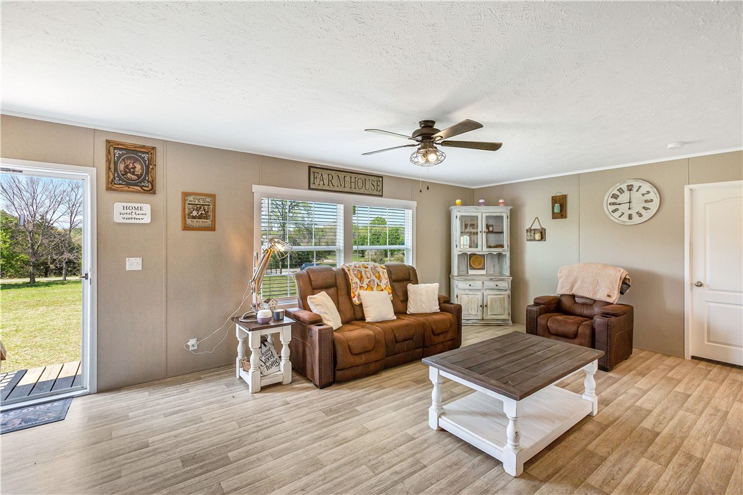 633 Project Road Iva, SC 29655 - Photo 6 of 38 This living area offers a relaxed ambiance with comfortable seating and natural light.