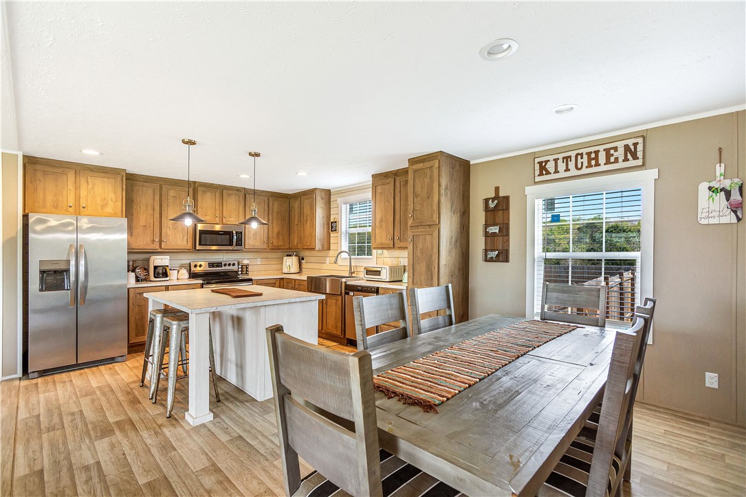 633 Project Road Iva, SC 29655 - Photo 7 of 38 This inviting kitchen and dining area offers functional design and modern comfort.