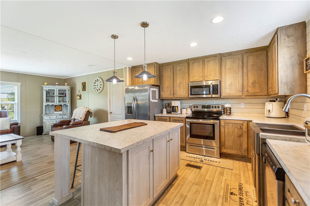 633 Project Road Iva, SC 29655 - Photo 8 of 38 This spacious kitchen with an island is perfect for culinary endeavors and gatherings.