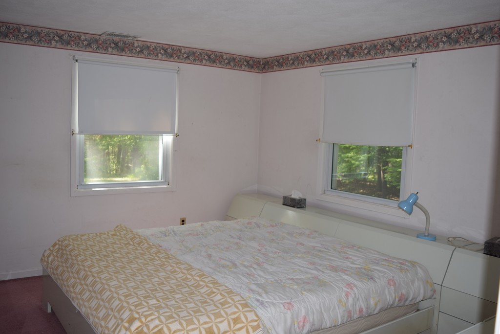 71 Old Stage Road Chelmsford, MA 01824 - Photo 12 of 15 a bedroom with a bed and a window