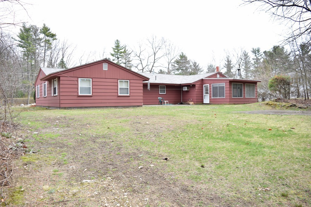 71 Old Stage Road Chelmsford, MA 01824 - Photo 15 of 15 a large house with a big yard and large trees