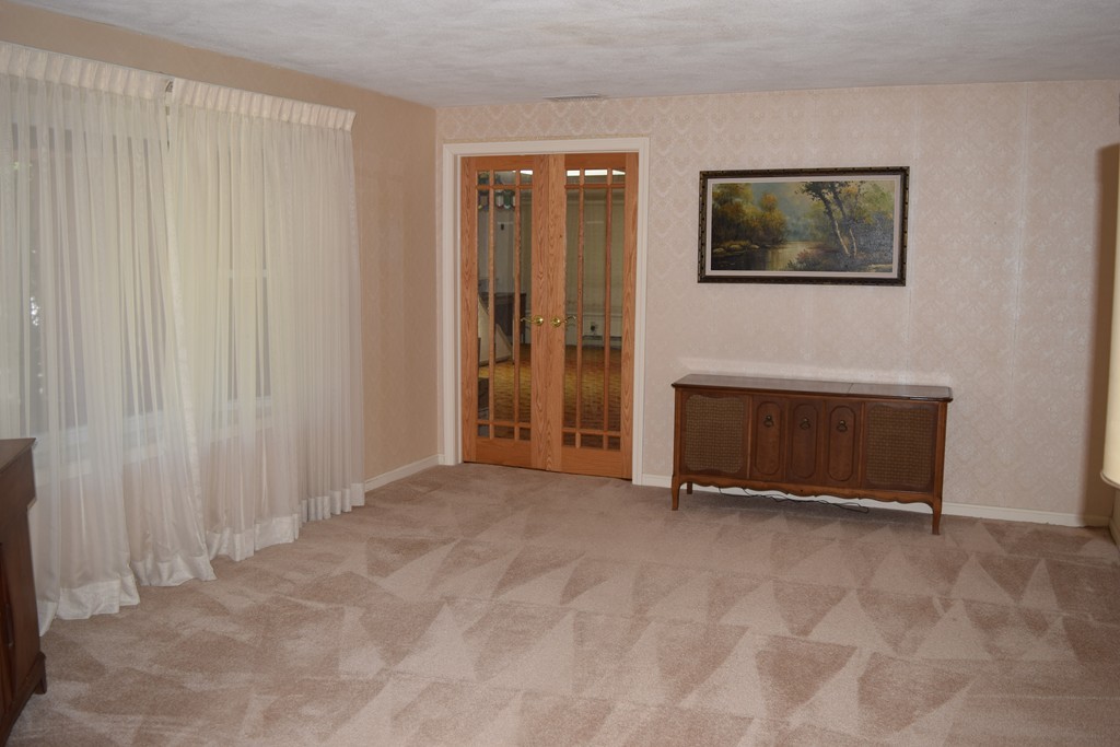 71 Old Stage Road Chelmsford, MA 01824 - Photo 5 of 15 a view of a livingroom with an empty space and a window