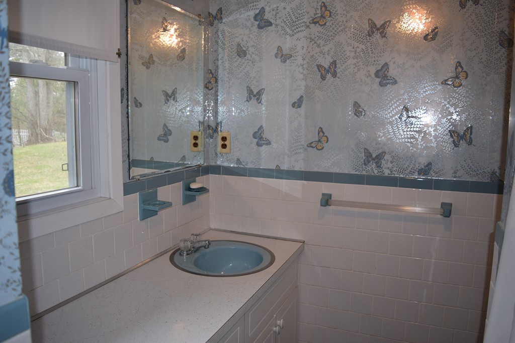 71 Old Stage Road Chelmsford, MA 01824 - Photo 8 of 15 a bathroom with a sink and a mirror