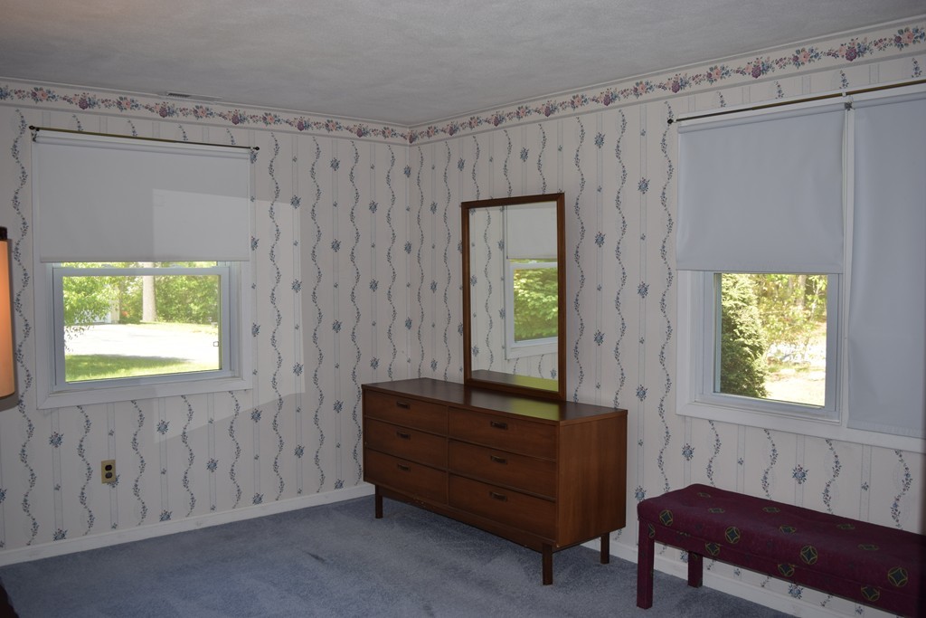 71 Old Stage Road Chelmsford, MA 01824 - Photo 9 of 15 a room that has a dresser and a window in it