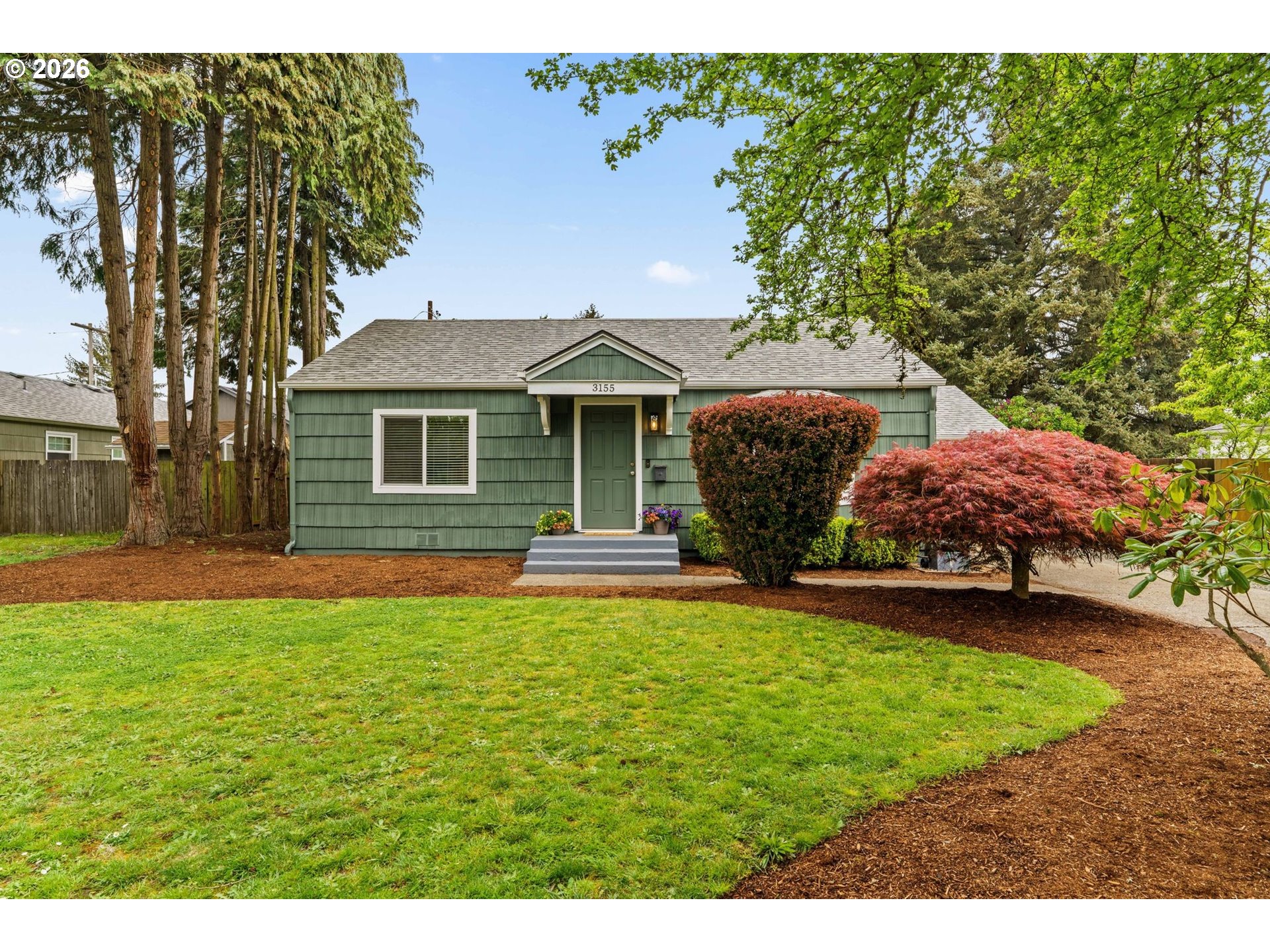 3155 Bell Avenue Eugene, OR 97402 - Photo 1 of 30 a front view of a house with a garden